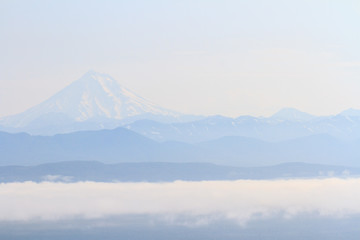Fototapeta na wymiar Vilyuchinsky volcano in the fog, Kamchatka peninsula, Russia