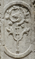Crosier head in the shape of a wolf, ancient religious stone relief in Venice