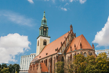 The Church of St. Mary in Berlin in Germany on the Alexanderplatz square against the blue sky in autumn.