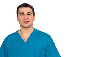 Fototapeta premium Young doctor wearing blue gown on white background