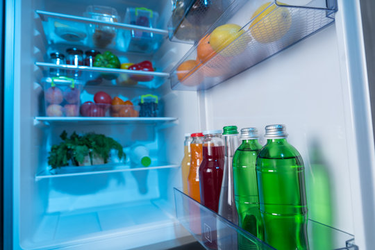 Fully stocked fridge with fresh food and beverages