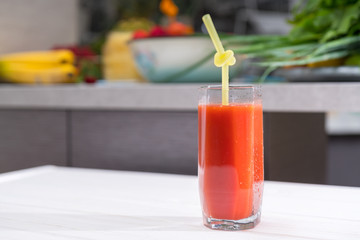 Glass of fresh vegetable juice with straw