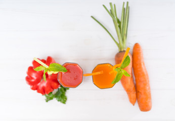 Top down view on tomato and carrot smoothies