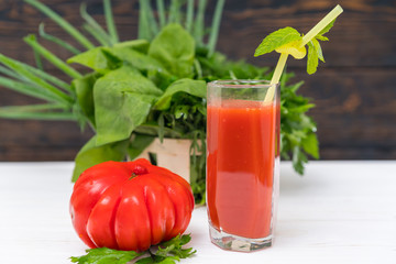 Fresh tomato smoothie or juice in a tall glass