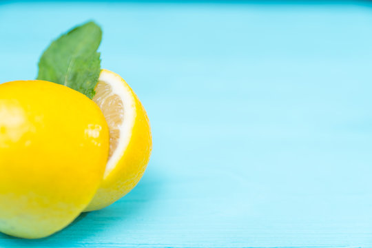 Ripe fresh yellow lemon over turquoise blue