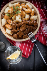 Beef stew with potatoes dumplings.