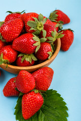 juicy fresh strawberry on a delicately blue background