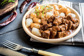 Beef stew with potatoes dumplings.