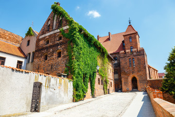 view of historical buildings in polish medieval town Torun in Poland. Torun  is listed among the UNESCO World Heritage Sites - obrazy, fototapety, plakaty