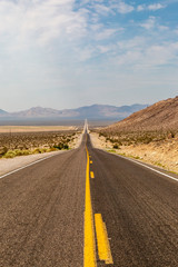 Looking down the long straight road leading to Death Valley