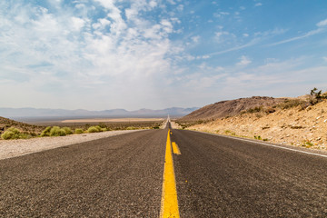 Looking down the long straight road leading to Death Valley