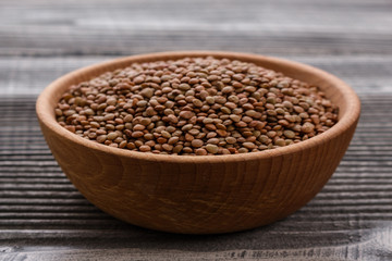 raw lentils on a wooden rustic background