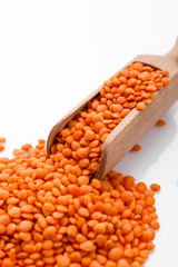 raw lentils on a white acrylic background