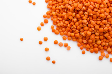 raw lentils on a white acrylic background