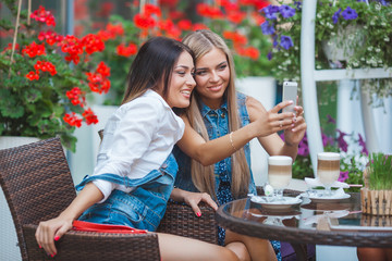 Group of young women making selfie outdoors