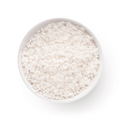 Uncooked white rice in bowl isolated