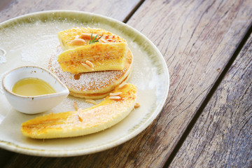 Pancakes with banana,hazelnut and caramel in the dish