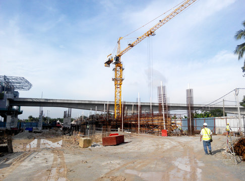 Construction site on progress at site. The construction of the building structure is still in its early stages. Earthwork work is also being done.