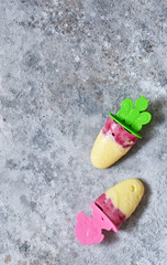 Summer cold dessert. Homemade vanilla ice cream with strawberries and raspberries. Two servings of ice cream on a concrete background.