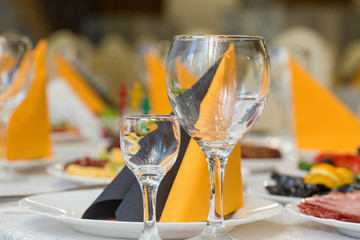 banquet hall of the restaurant, beautifully decorated tables with food	
