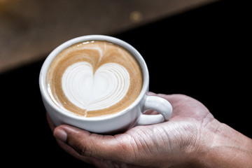 Making of cafe latte art, heart shape