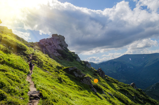 Fototapeta dangerous path in the high mountains against the blue sky