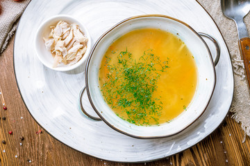 Chicken soup bouillon in a plate
