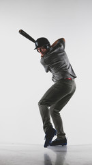 Caucasian professional baseball player batter wearing generic uniform posing as if he was hitting a ball isolated on white background