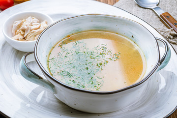 Chicken soup bouillon in a plate