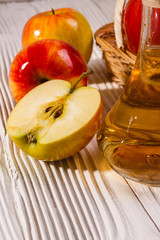 apple vinegar on a wooden rustic background