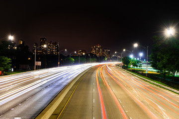 Long exposure shot at night overlooking north bound Lake Shore Drive in Chicago, Illinois