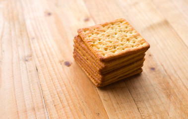 Biscuits crackers on wooden table. selective focus.