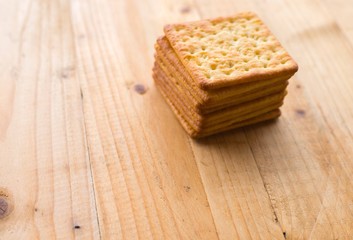 Biscuits crackers on wooden table. selective focus.