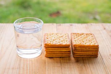 Fototapeta na wymiar Biscuits crackers and drinking water. selective focus.