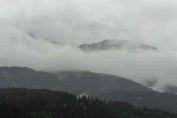 View on clouded and grey Ennstaler Alps