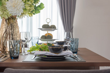 modern table set on wooden dining table