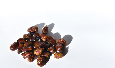 dried dates isolated on white background. selective focus.