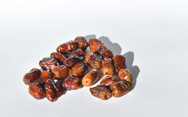 dried dates isolated on white background. selective focus.