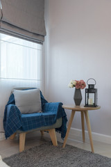 cozy blue chair with wooden round table
