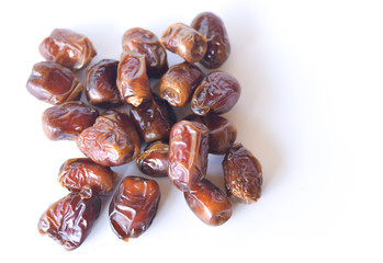 dried dates isolated on white background. selective focus.