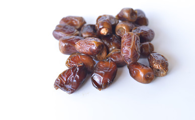 dried dates isolated on white background. selective focus.
