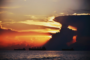 Fototapeta premium Landscape, sunset on the sea by ship.