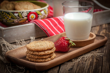 Stack of freshly baked oat biscuits in a bowl.