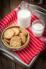 Stack of freshly baked oat biscuits in a bowl.