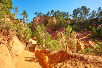 Red ocher cliffs in the village of Roussillon in Provence, Franc