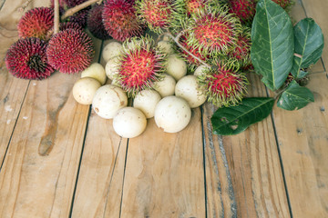 langsat,pulasan and rambutan on the wooden table
