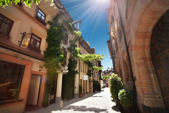 Narrow street of Freiburg im Breisgau at sunny day
