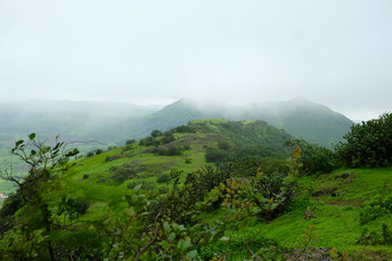 Lush green monsoon nature landscape mountains, hills, Purandar, Pune, Maharashtra, India 