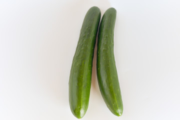 fresh green cucumbers isolated on white background.