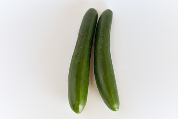 fresh green cucumbers isolated on white background.